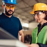 Plant operator monitoring workplace safety alarm systems